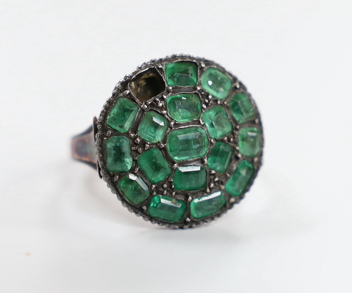 An early 19th century yellow and white metal, emerald cluster set ring, (stone missing), size O/P, gross weight 5.5 grams.